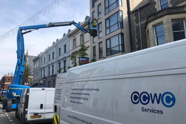 CCWC Services Team Cleaning Windows Of Building